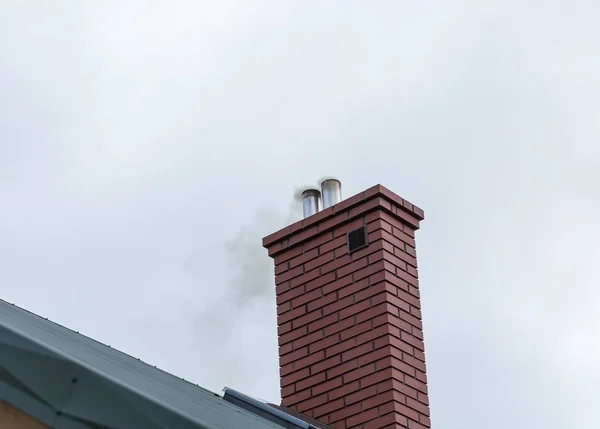 Chimney sweep cleaning a chimney in Frederick MD